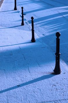 a graphic winters view of street bollards