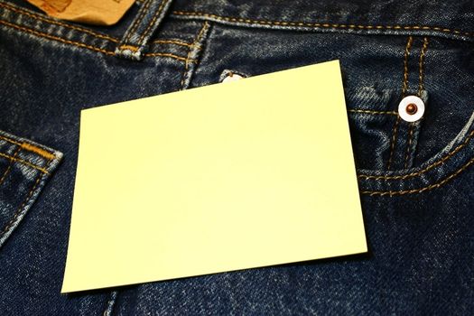 Yellow tag over jeans background place your own text here
