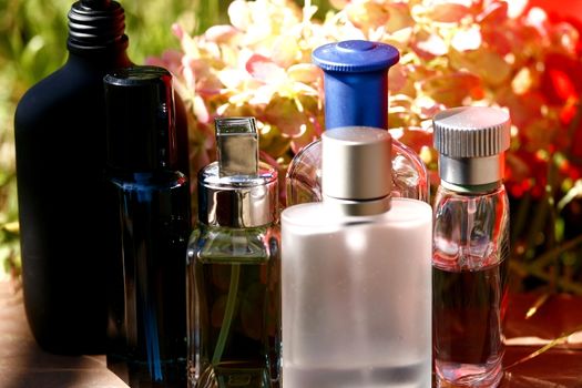 Glass bottles with perfumery in an environmental set-up