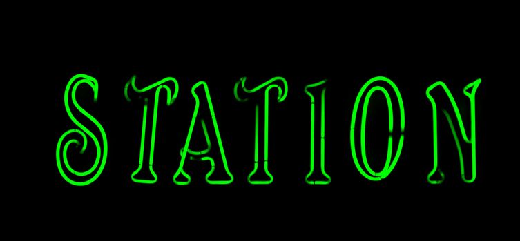 Green  station neon sign on black background