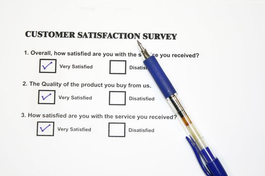 Satisfaction Survey questionnaire on white with pen
