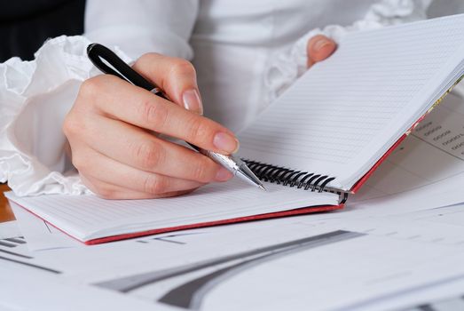 young businesswoman sign important documents