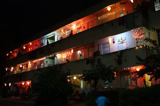 A building traditionally decorated with colorful lights and sky-lanterns, on the occasion of Diwali festival in India.