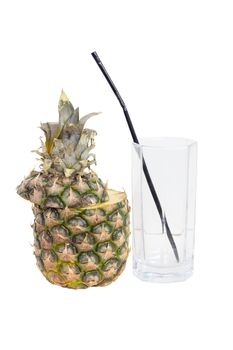 Sliced pineapple and an empty glass tube, isolated on a white background.