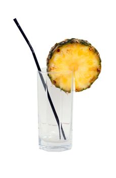 Empty glass with straw and a slice of pineapple, isolated on a white background.