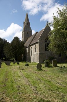 A rural church with graveyard and head stones