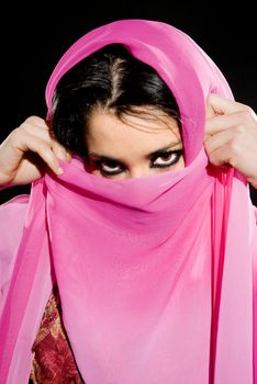 Arabian woman wearing traditional dress on black background
