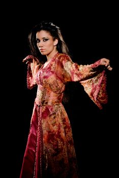 Arabian woman wearing traditional dress on black background