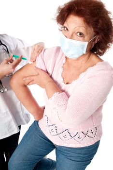 Senior woman getting flu vaccine on white background.