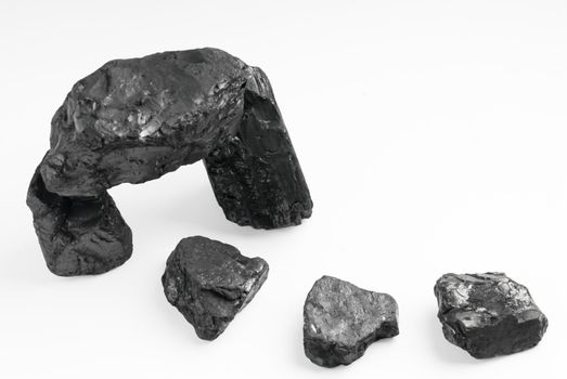 Carbon nuggets on a white background 