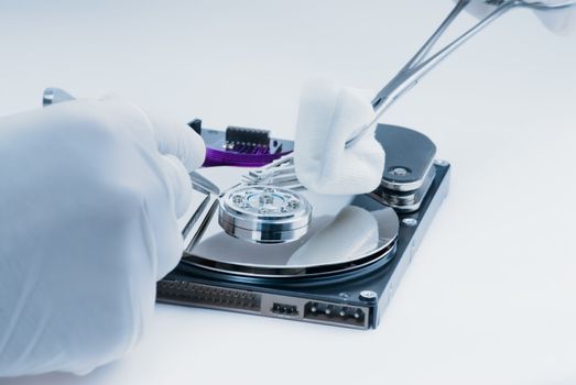 Repair of a hard disk by a surgeon medic. 