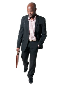 Happy african businessman smiling with briefcase isolated.