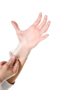 Doctor hand by getting gloves on white background. 