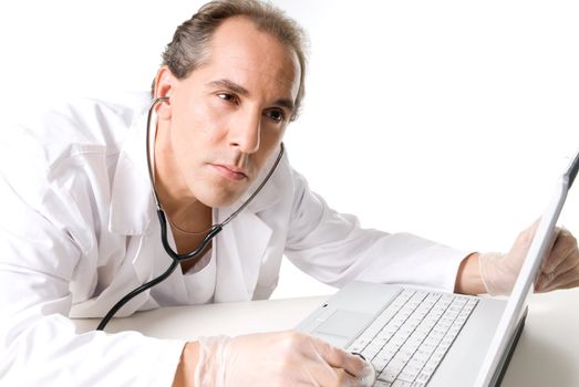 Doctor with stethoscope fixing laptop, good technical support symbol. 