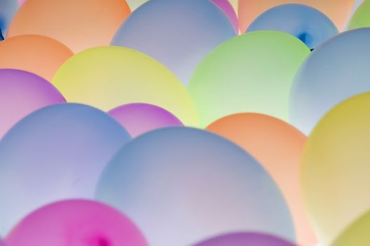 abstract texture background of backlite colorful ballons in different sizes