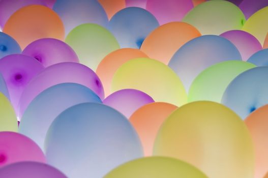 abstract texture background of backlite colorful ballons in different sizes