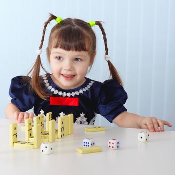 A smiling girl sitting at the table