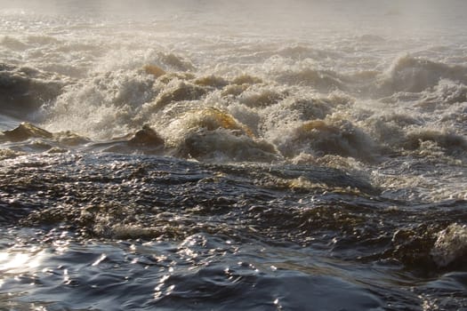 august foggy morning: river, foam; splashes
