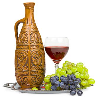 Still life - a clay jug, a glass of wine and grapes isolated on white