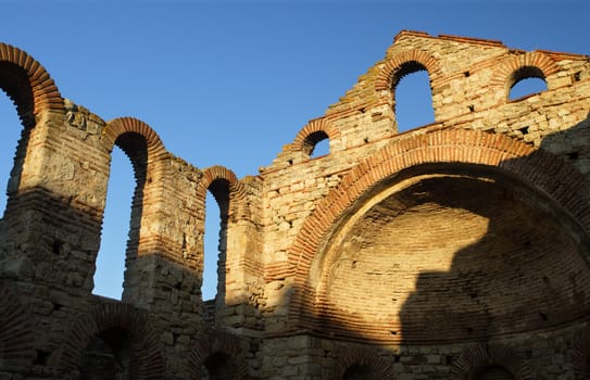 The ruins of an ancient basilica in Nessebar, Bulgaria - late in the day as the sun started to set.
