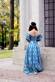 Portrait of lady in blue baroque dress
