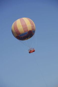 beautifully colored hot air balloon on the clear summer sky