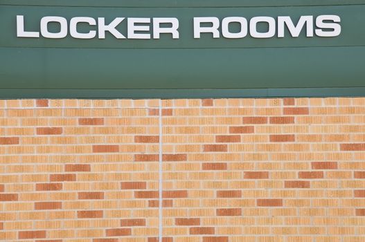 Locker Rooms sign at a football field