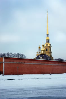Peter and Paul Fortress, the bridge with a lantern, a fence on the bridge, gloss spire and domes, symbol of Russia, a symbol of St. Petersburg