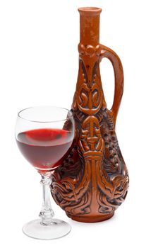Ancient Georgian bottle and a glass of wine isolated on white background
