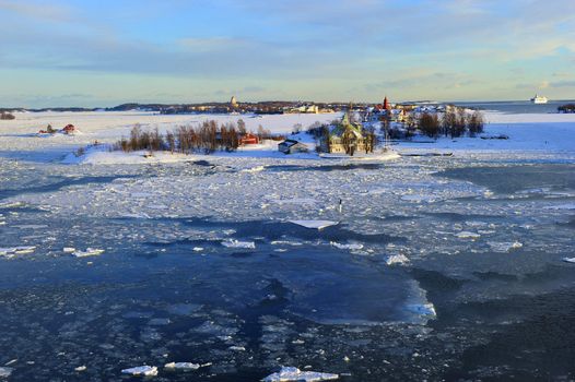 Icy Baltic sea around Helsinki, with Finnish houses on islands