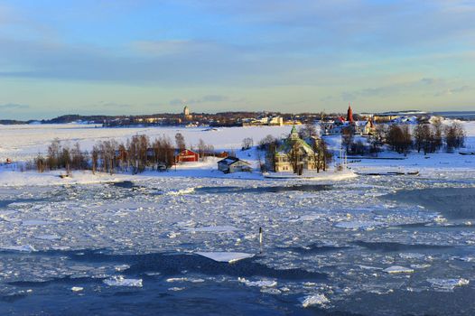 Icy Baltic sea around Helsinki, with Finnish houses on islands