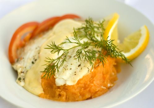 Baked plaice with vegetable puree and lemon cream sauce