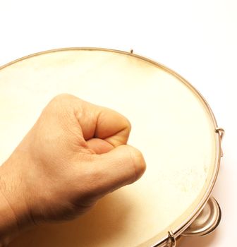 Pandeiro and man hand - brazilian ethnic drums over white background