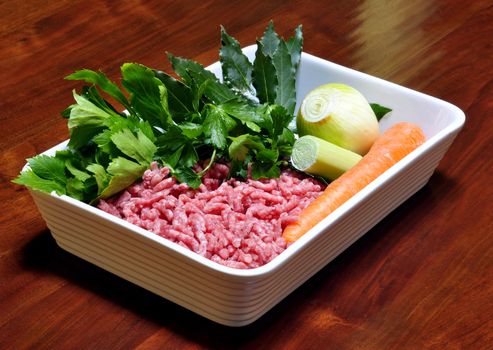 raw minced beef with carrots, parsley and onion