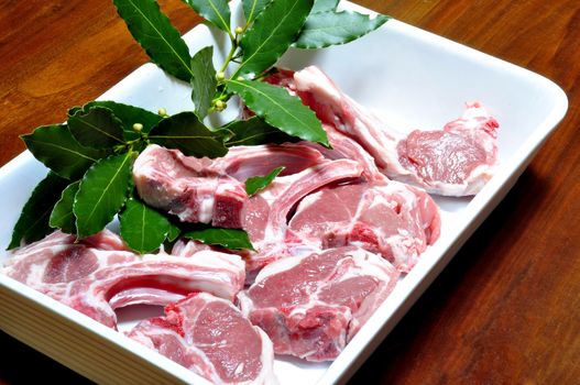 lamb chops with bay leaves in a baking dish