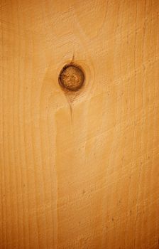 Plank of light pine wood used for fencing with large knot