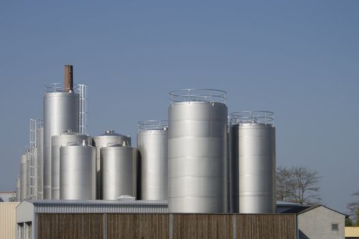 Factory for Industrial Manufacturing. Storage towers at dairy plant. 