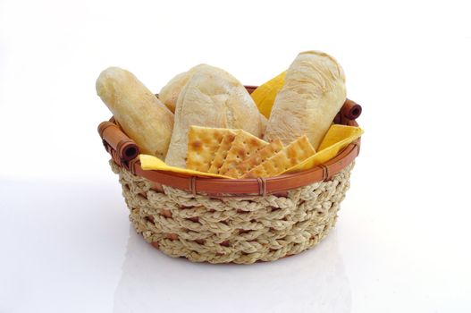 basket of bread and crackers on white background