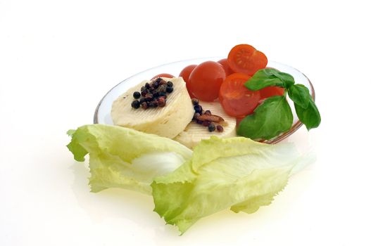 tomatoes, cheese and salad on white background