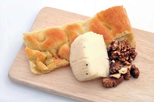 Focaccia, cheese and nuts on white background