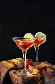 two cups with cocktail glass on a black background