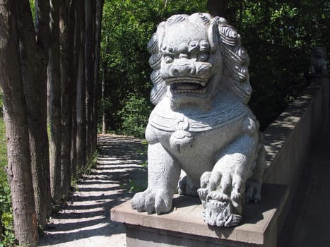 Lion statue sculpture in a Japanese Far East garden
