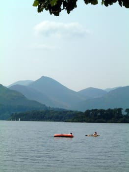 children playing in boats on Derwent water