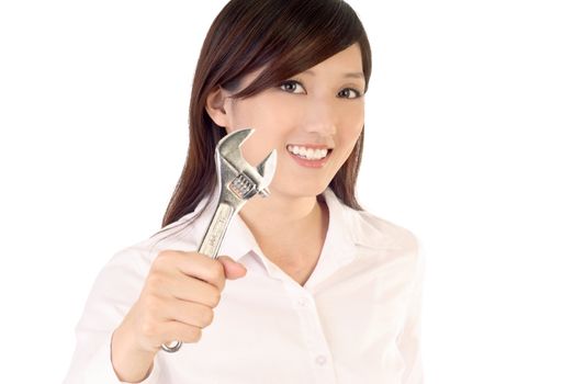 Businesswoman holding wrench to fix on white background.