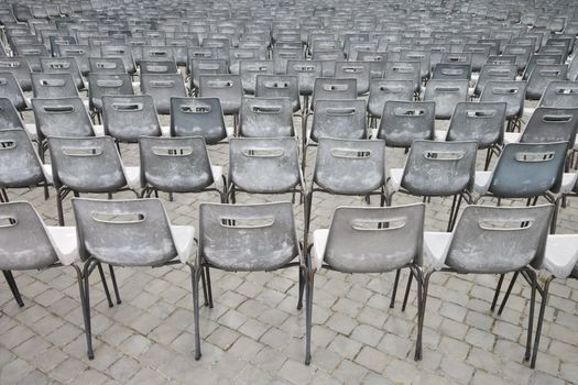 Close-up shot of several chairs in Saint Peter's Square in Vatican City, Italy.