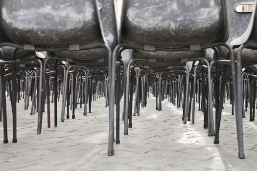 Worm's eye view of several chairs in Saint Peter's Square in Vatican City, Italy.