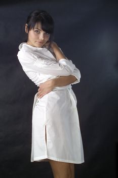 dentist doctor a woman in a white apron with the tool