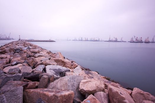 Long exposure of a seaside jetty in the very early morning
