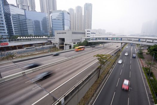 It is a highway with car in Hong Kong