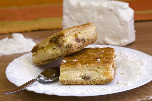 traditional cheese pie, freshly baked, with ingredients in background